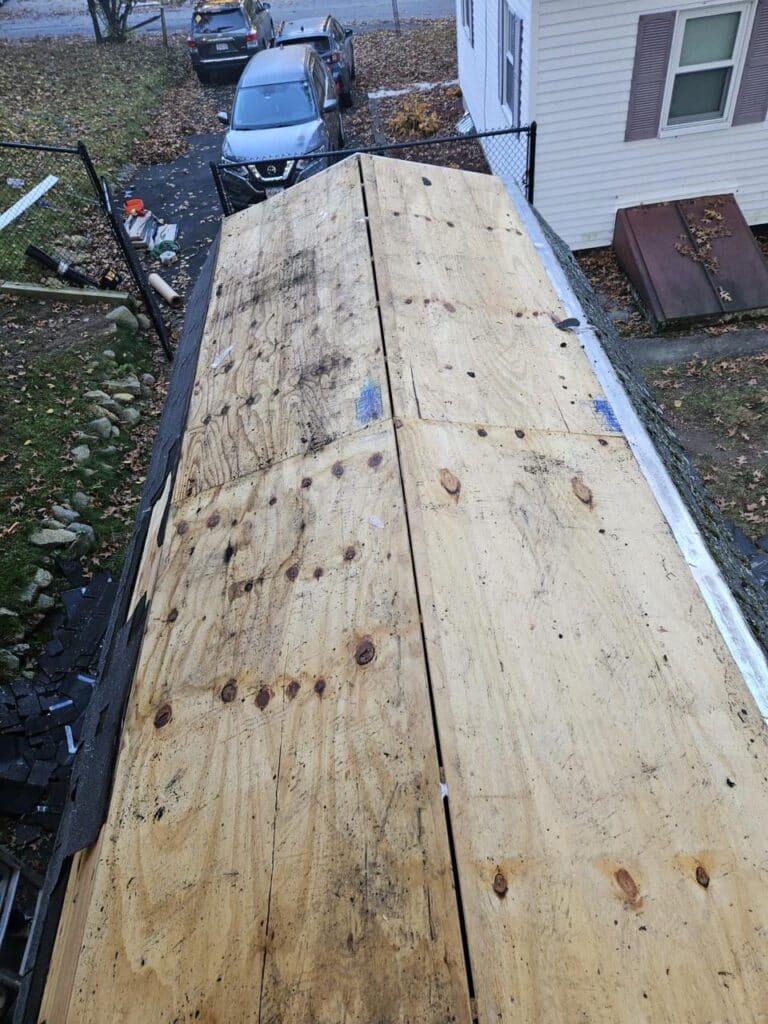 Fresh plywood roof decking installed after the old shingles came off.